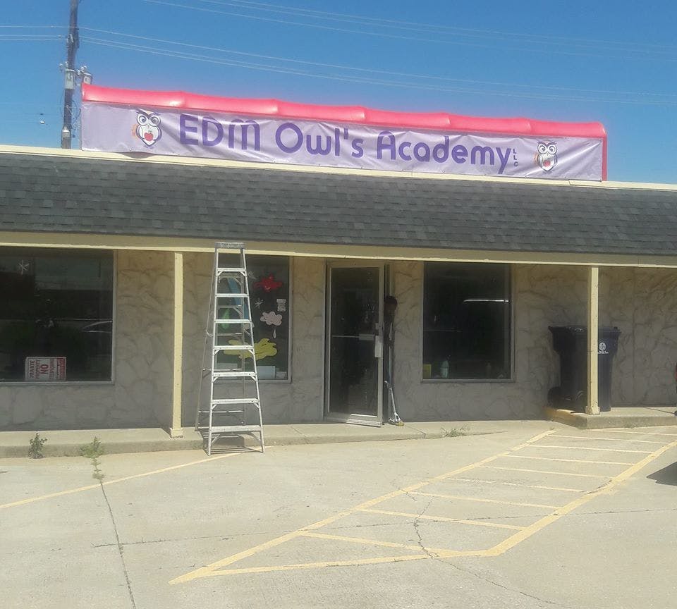 Building with a banner that reads "Edin Owl's Academy"
