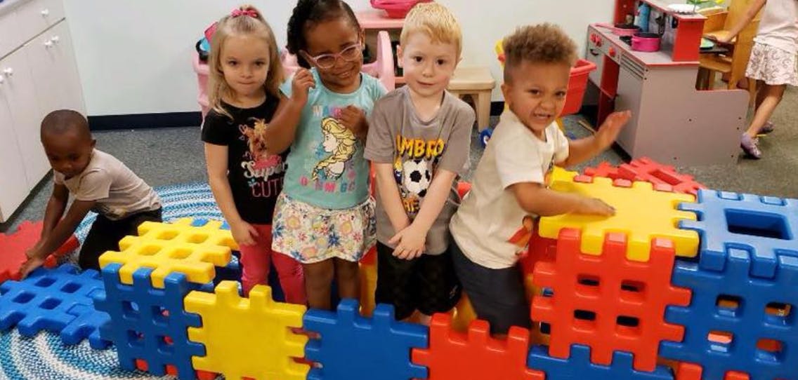 Children playing with large interlocking blocks