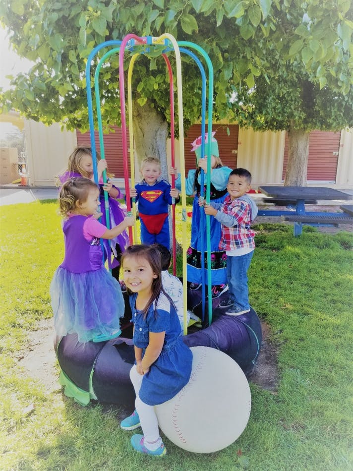 Children playing on outdoor playground equipment