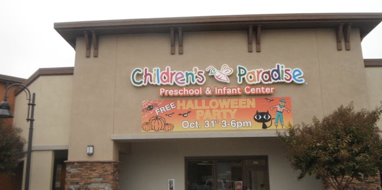 Children's Paradise Preschool & Infant Center building with Halloween party sign
