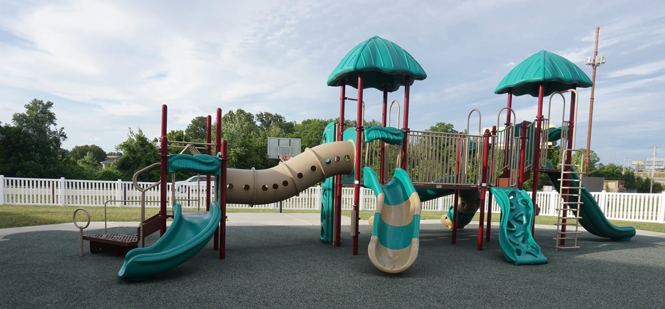 Playground with slides, tunnels, and climbing structures