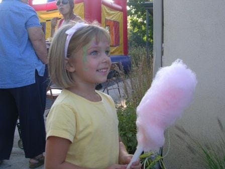 Child holding cotton candy