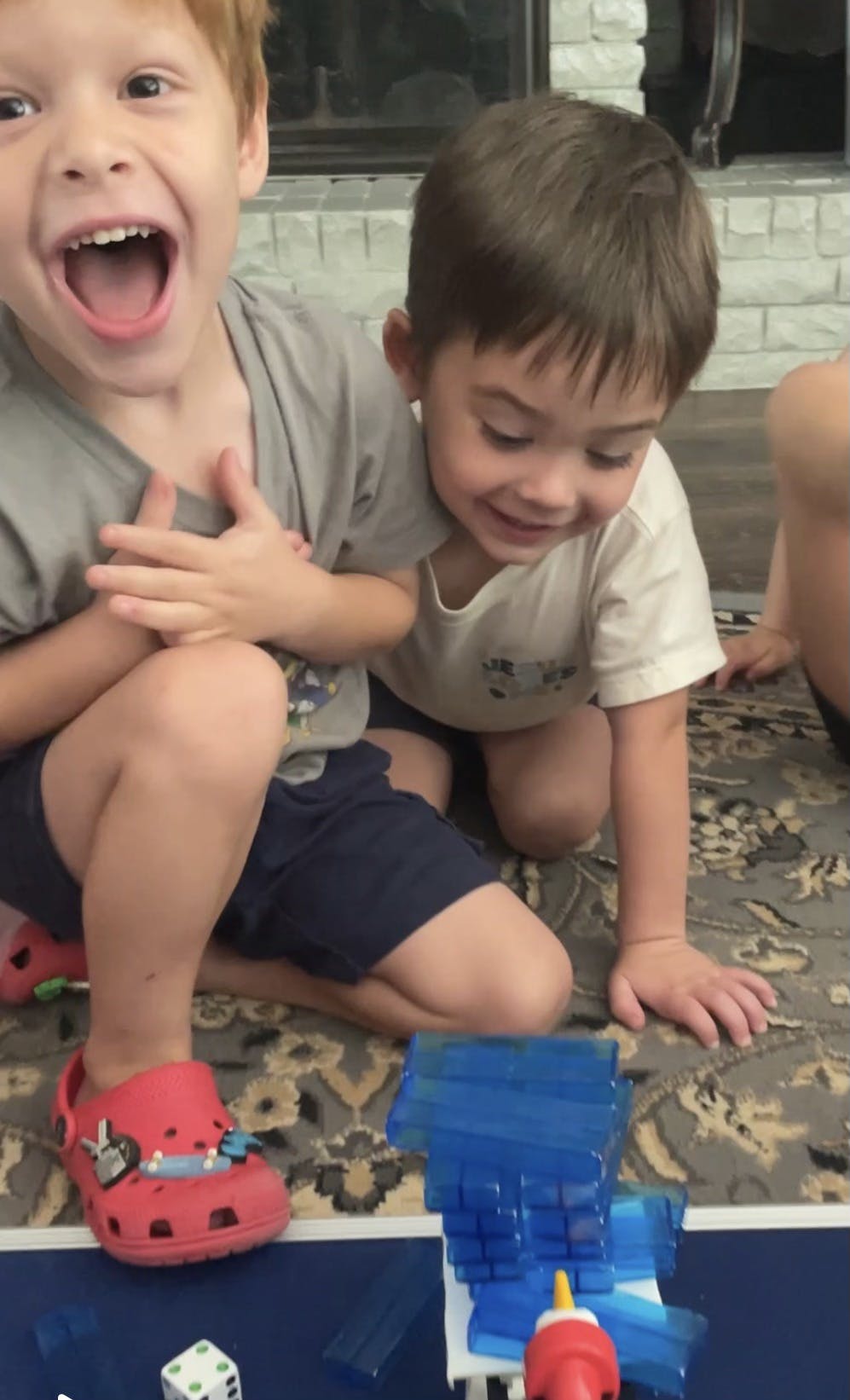 Two children playing with a toy