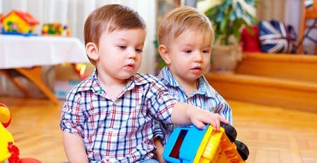 Two children playing with toys