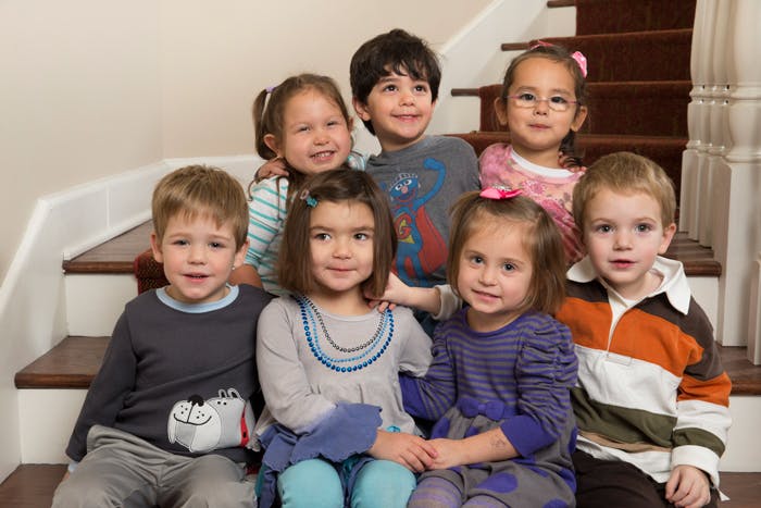 Group of children sitting on stairs