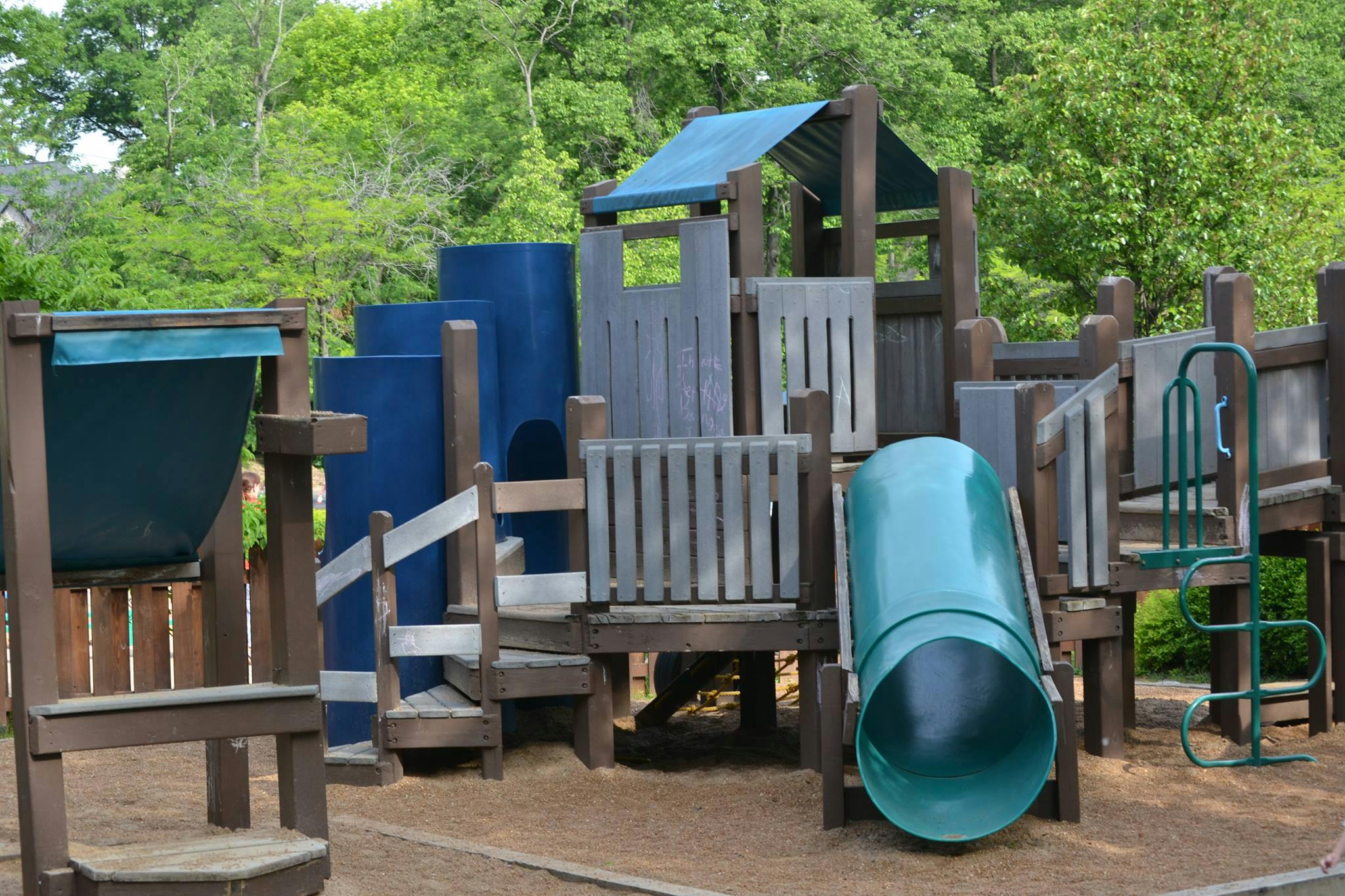 Playground structure with slides and climbing elements