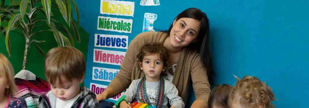 Person with children in a classroom