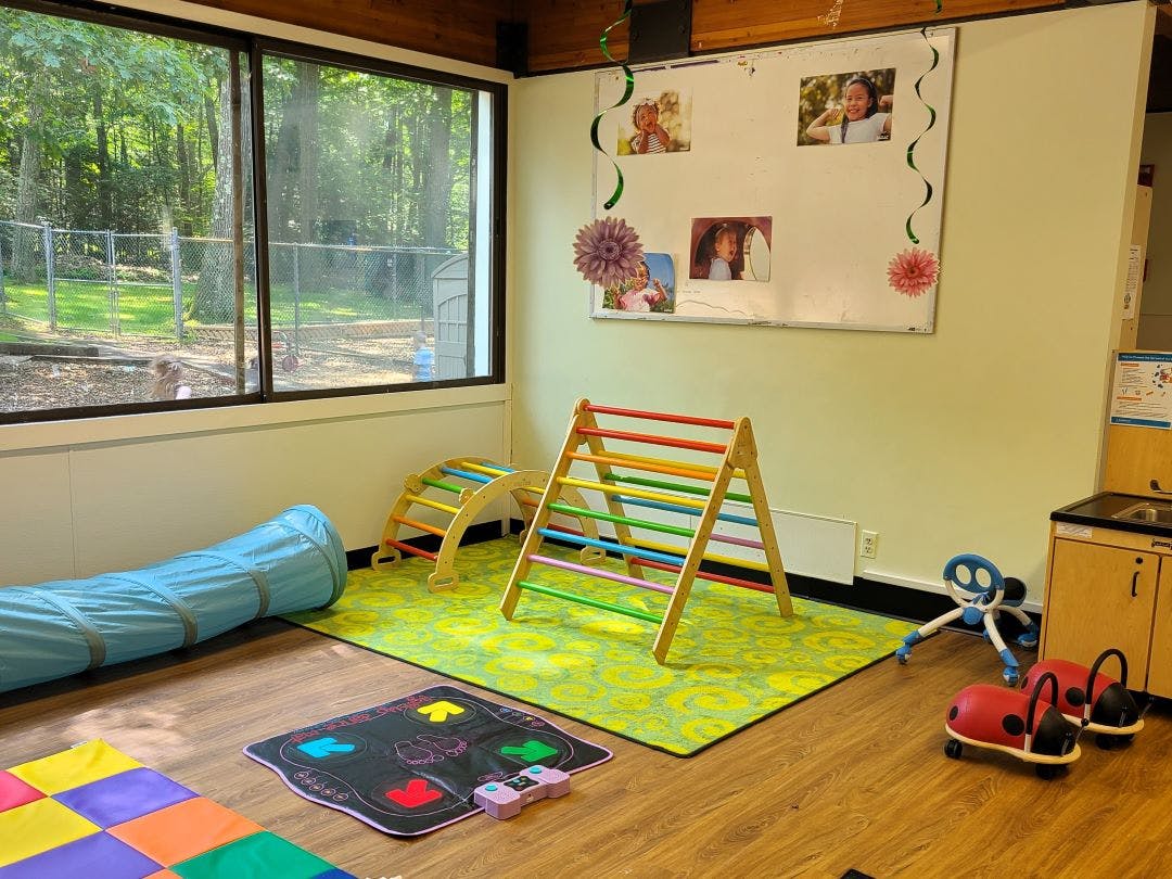 Children's indoor play area with climbing structures and toys