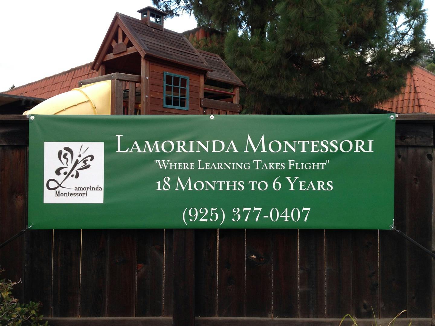 Lamorinda Montessori banner on a fence