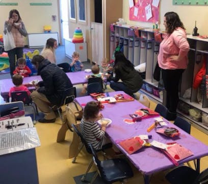 Adults and children in a classroom