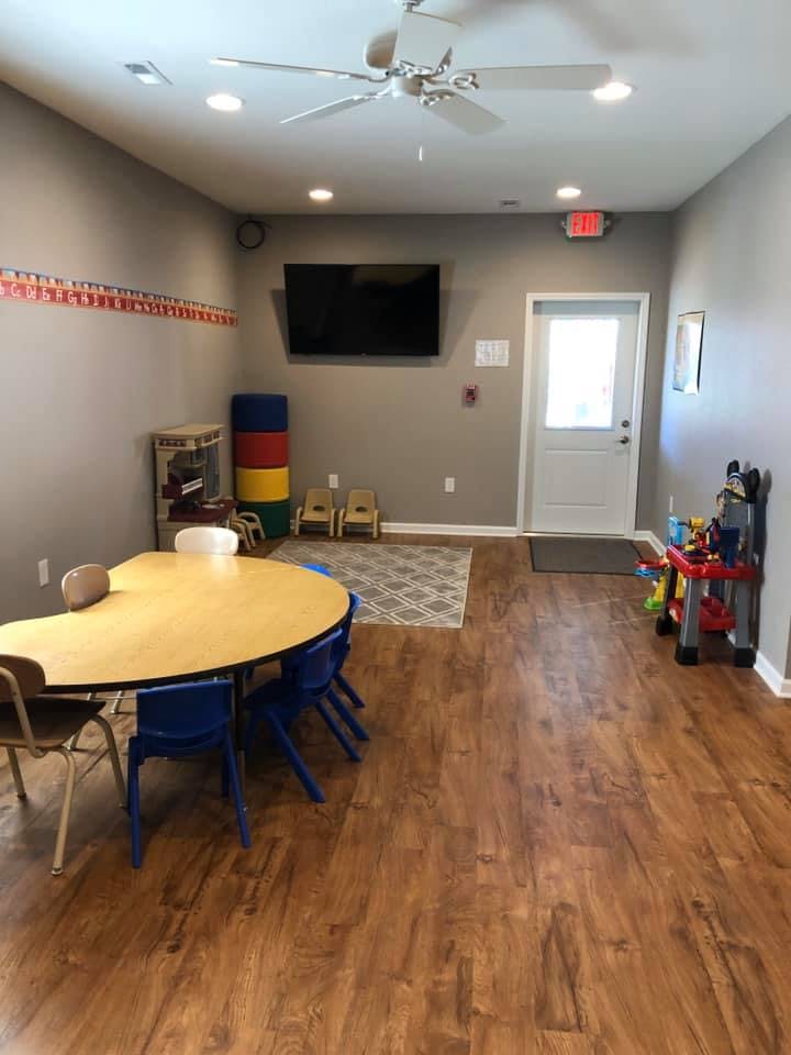 Classroom with a crescent-shaped table and small chairs