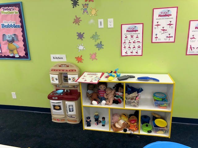 Play kitchen and toy shelf in a classroom