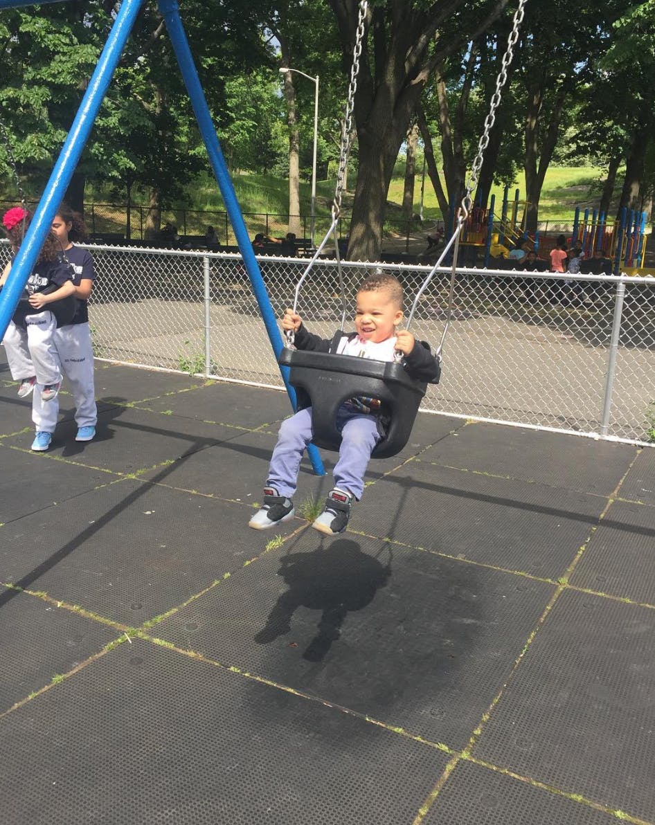 Child in a swing at a playground