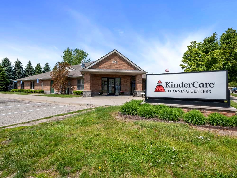 KinderCare Learning Centers sign in front of a brick building
