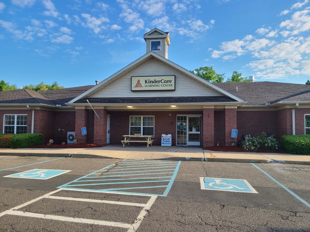 Brick building with a KinderCare Learning Center sign above the entrance