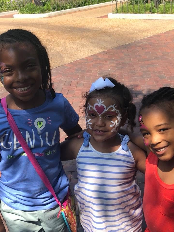 Three children with face paint