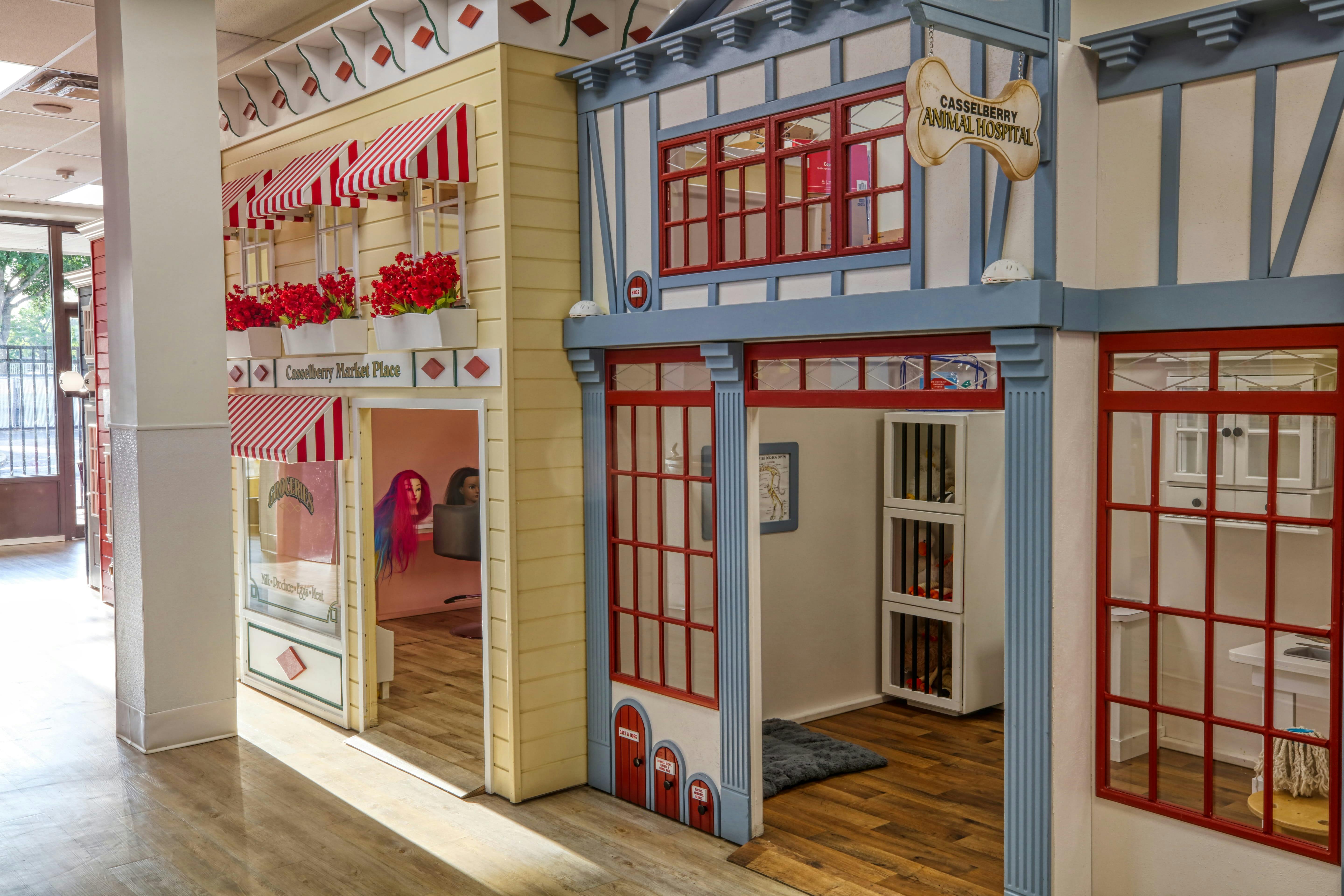 Playhouses for children designed as a market place and an animal hospital