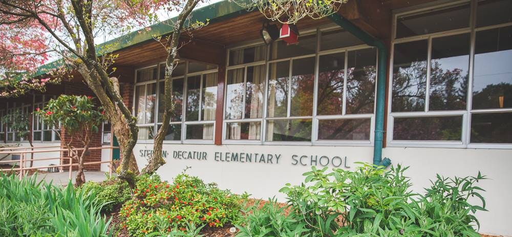 Exterior of a building with "ELEMENTARY SCHOOL" on the wall