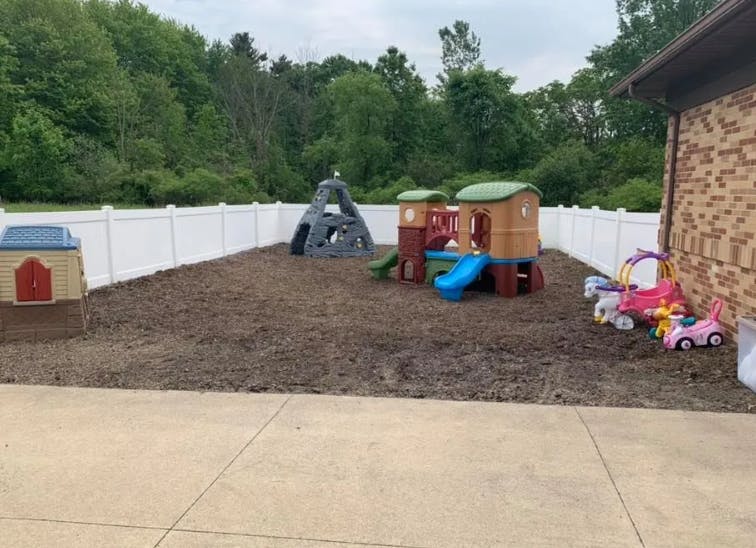 Outdoor play area with playhouses and toys