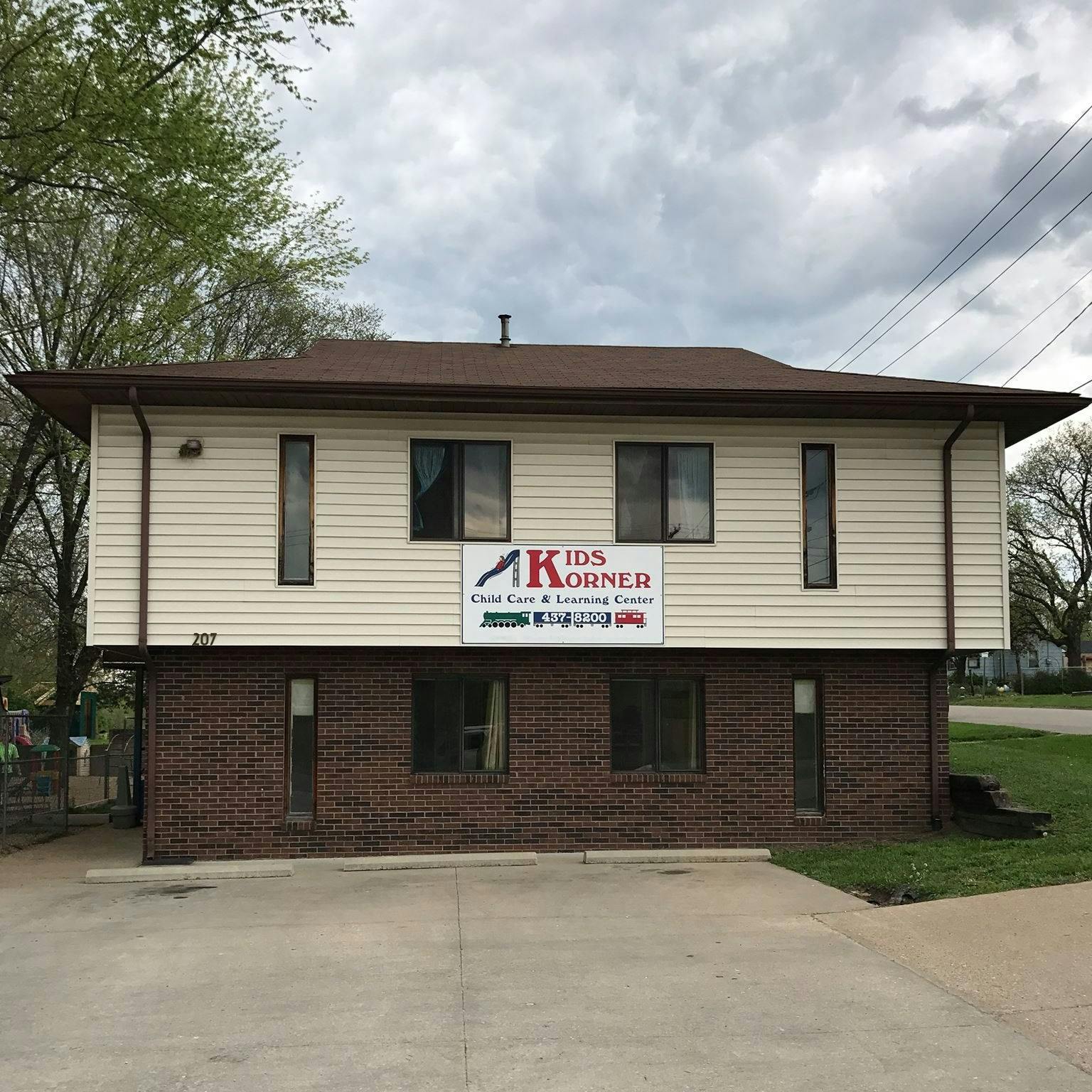 Building with a sign that reads "Kids Korner"