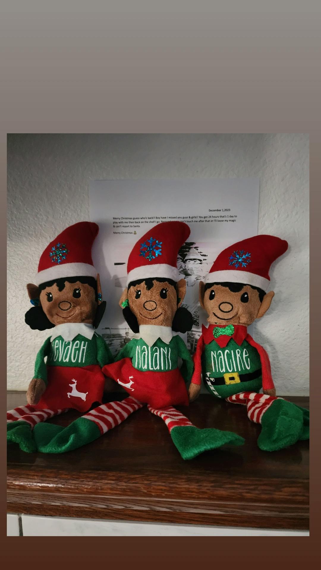 Three elf dolls with red hats and green outfits