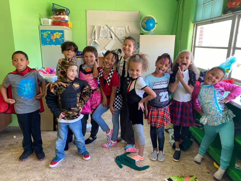 Group of children posing in a room