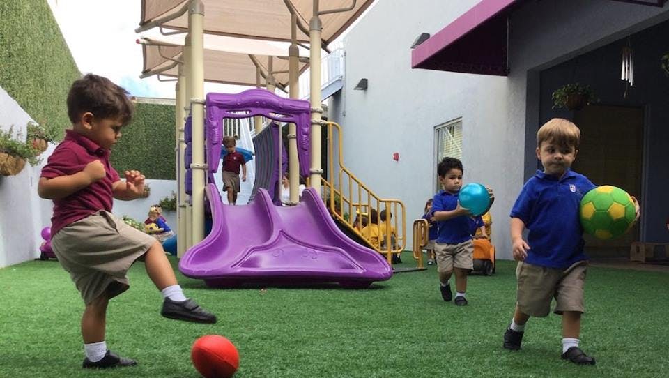 Children playing with balls on a playground