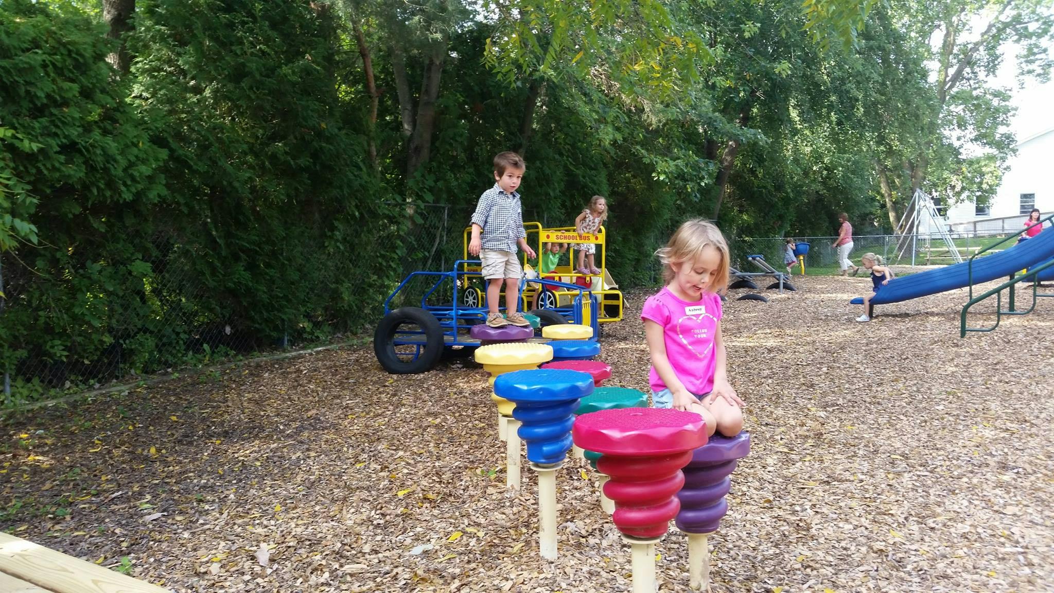 Children playing on playground equipment