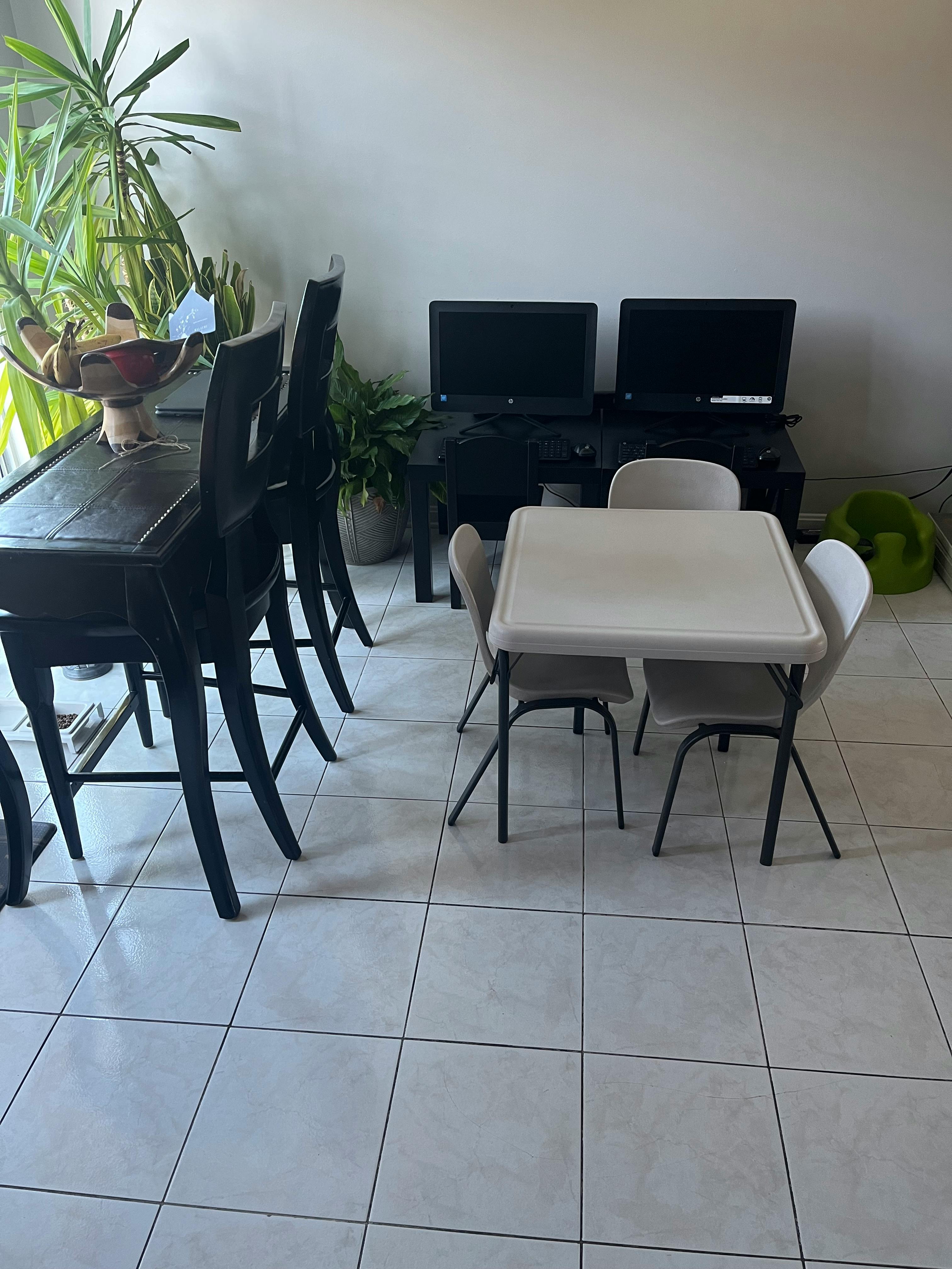 Dining table with chairs and a small table with chairs