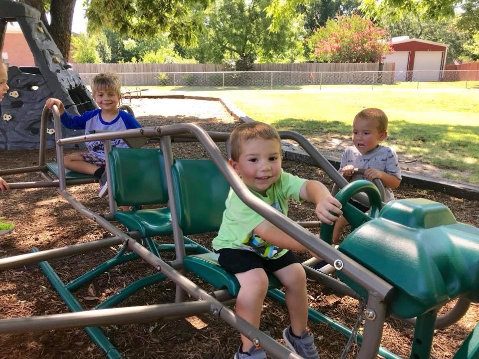 Children playing on a playground structure