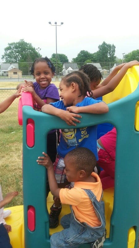 Children playing on a playground structure