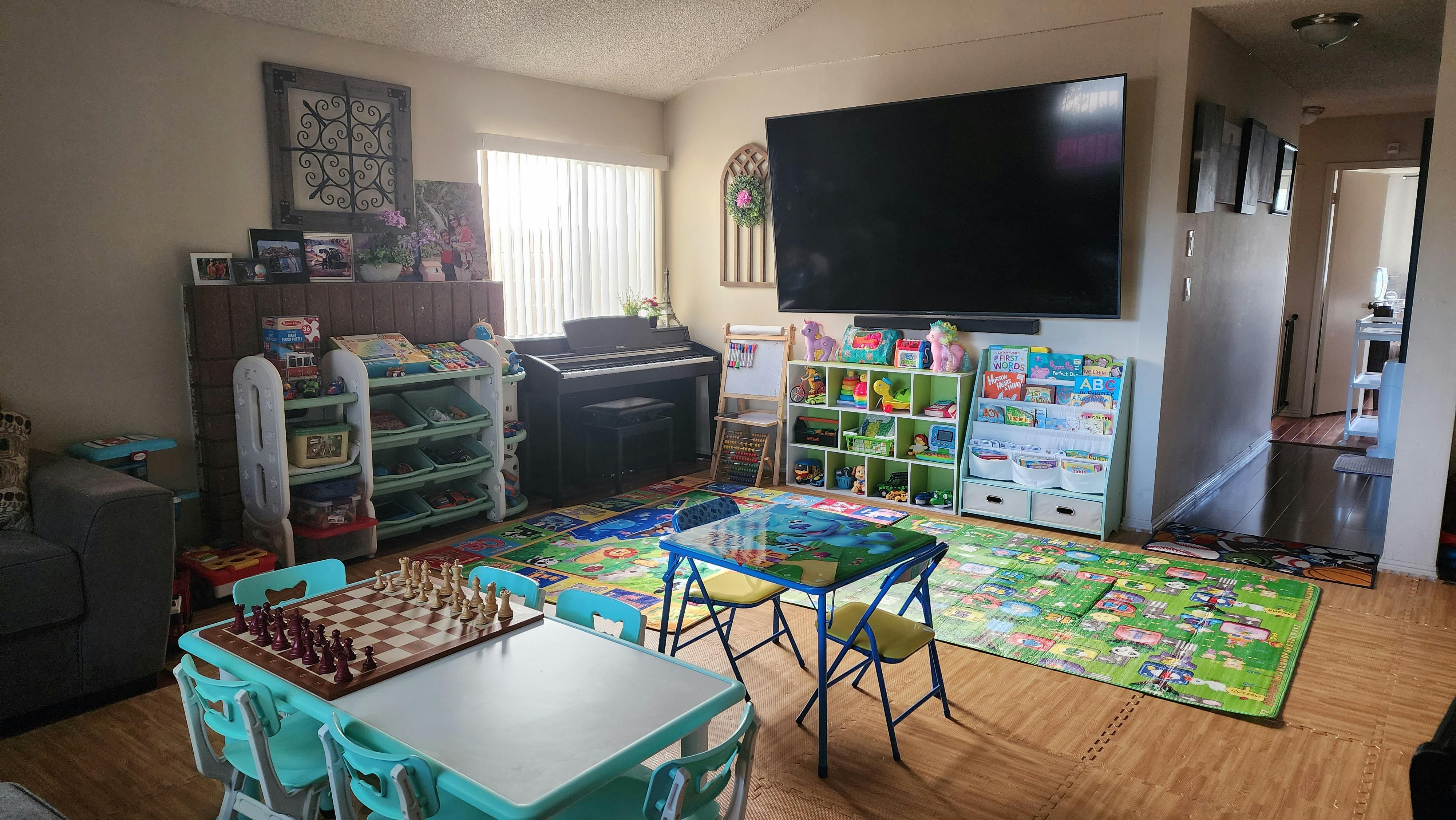 Living room with children's tables, chairs, and toys