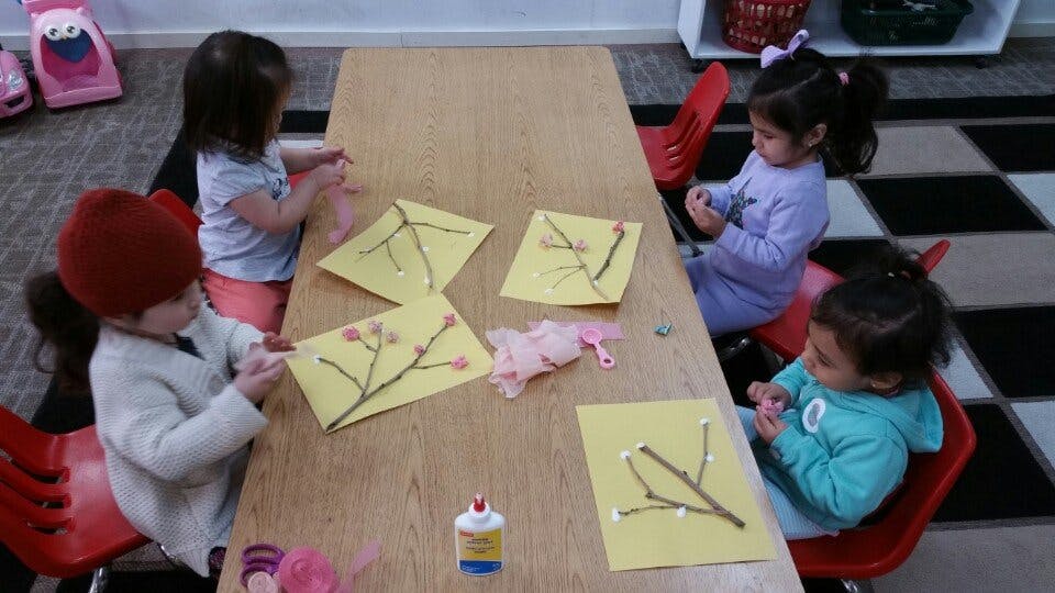 Children doing crafts at a table