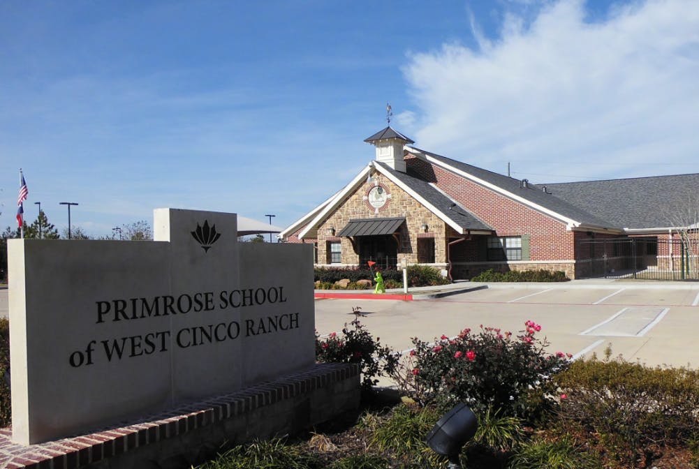 Primrose School of West Cinco Ranch sign in front of a school building