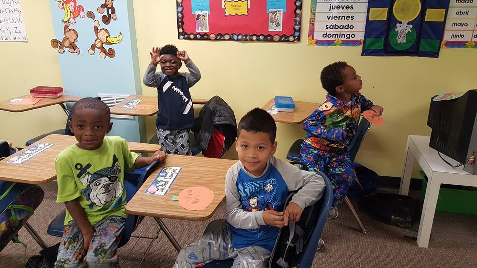 Four children in a classroom