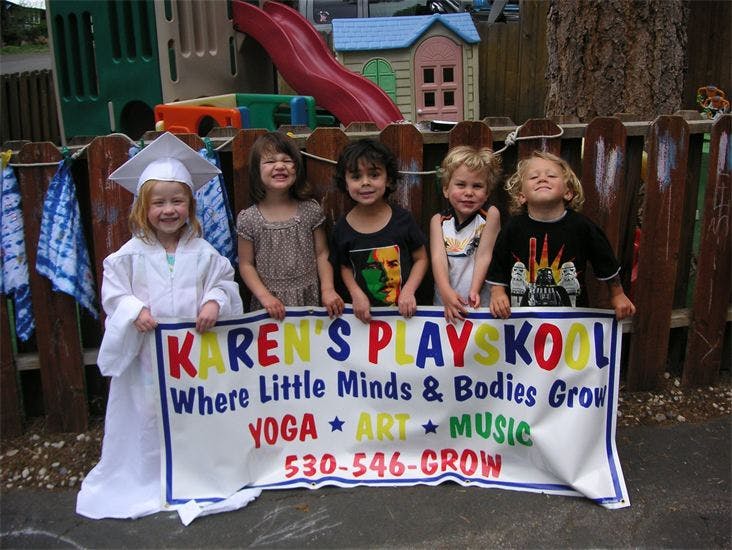 Five children holding a banner for Karen's Playskool