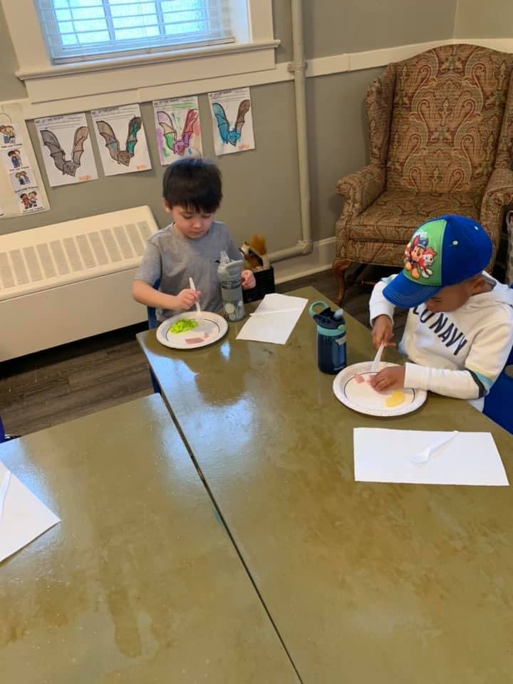 Two children eating at a table