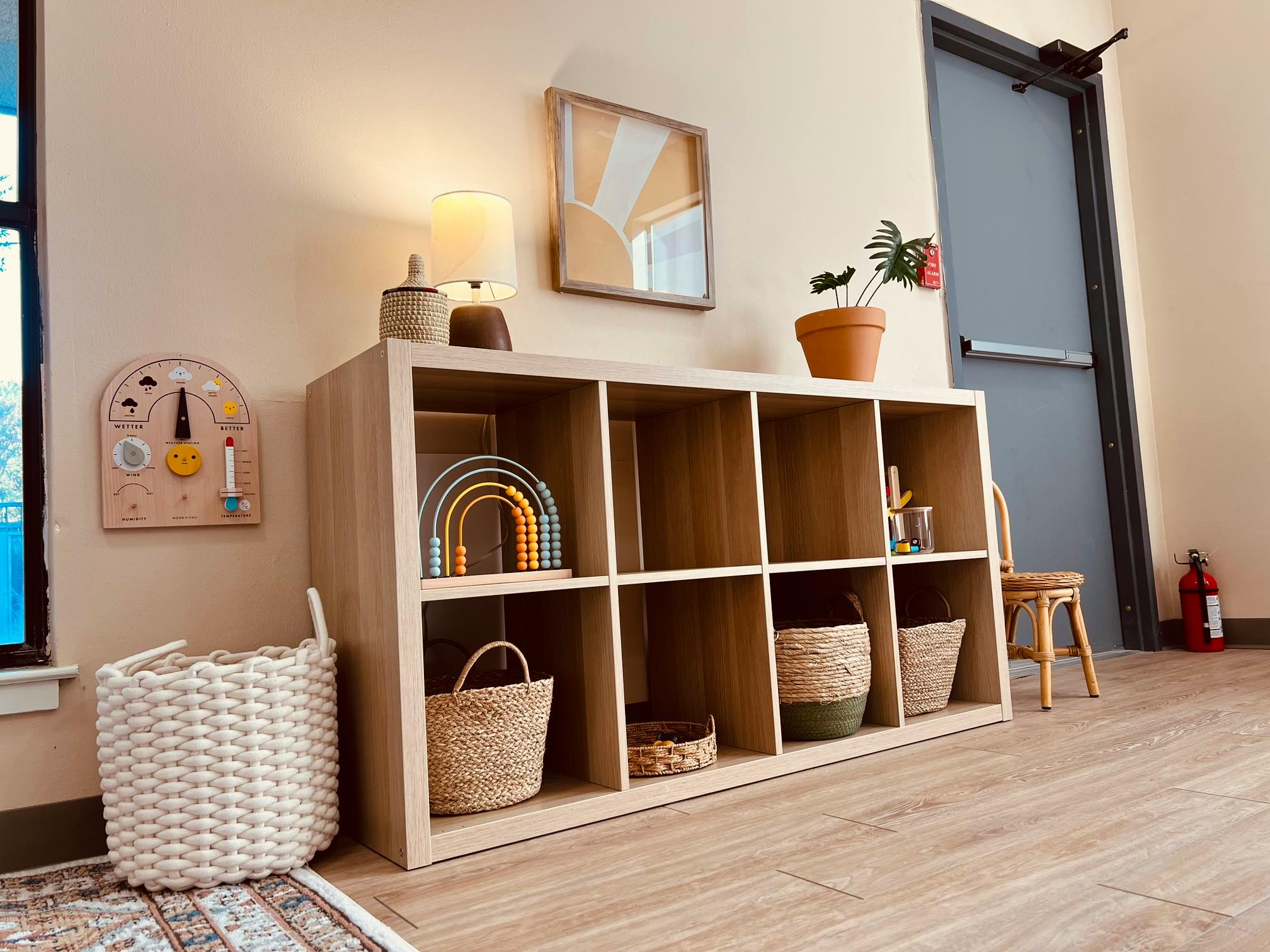Storage cubbies with baskets and decor in a room
