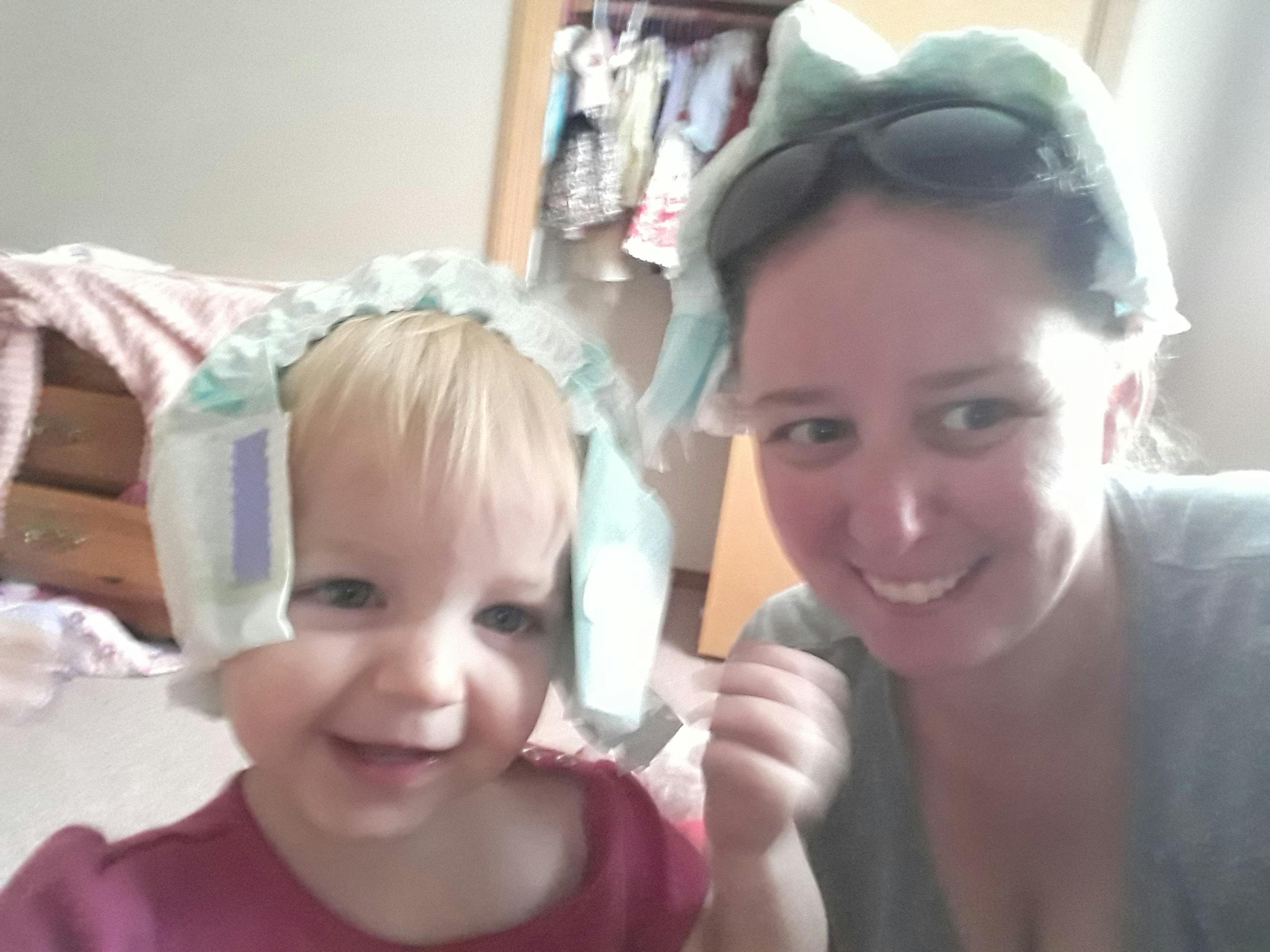 Person and child with diapers on their heads