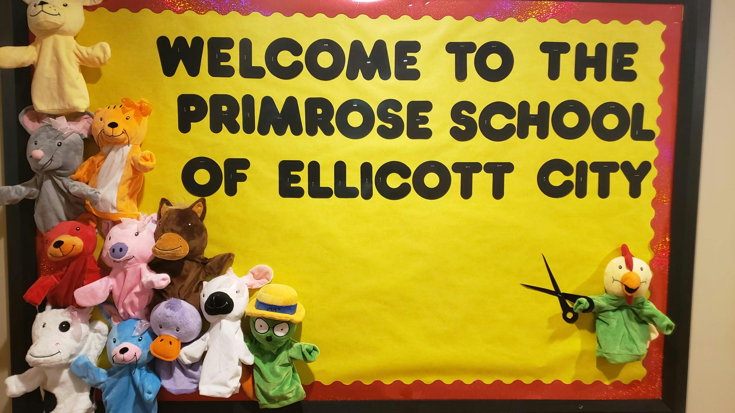 Welcome to The Primrose School of Ellicott City sign with puppets