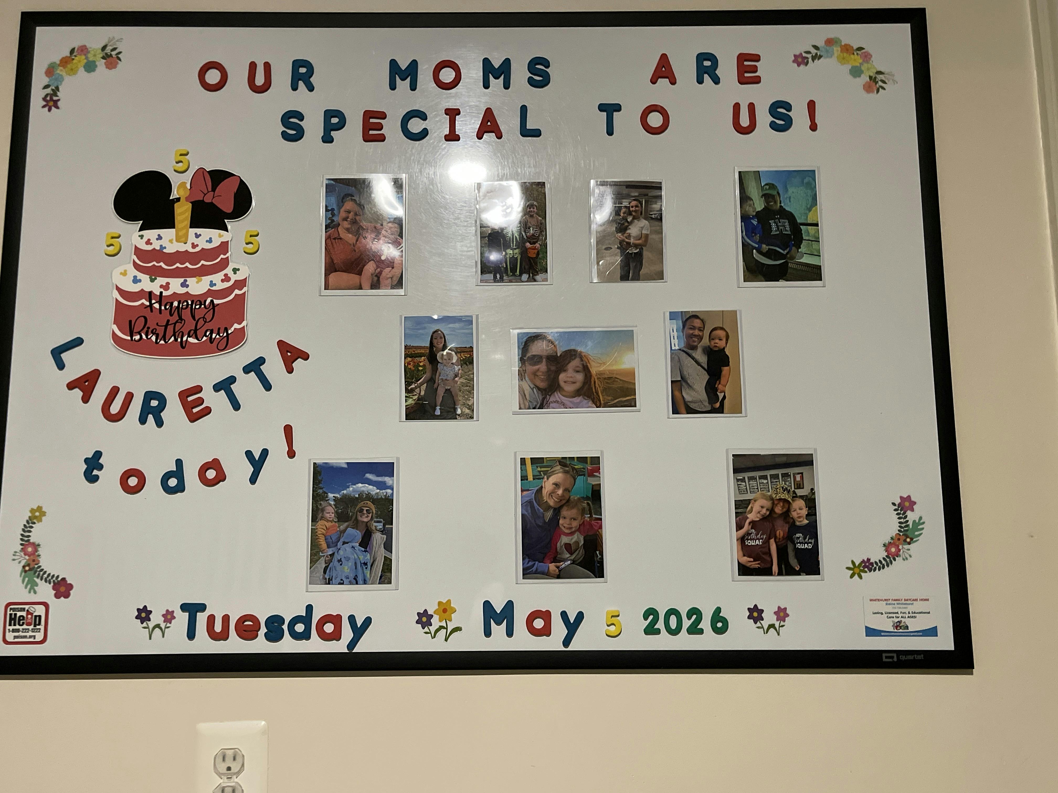 Decorative bulletin board featuring photos of children with their mothers