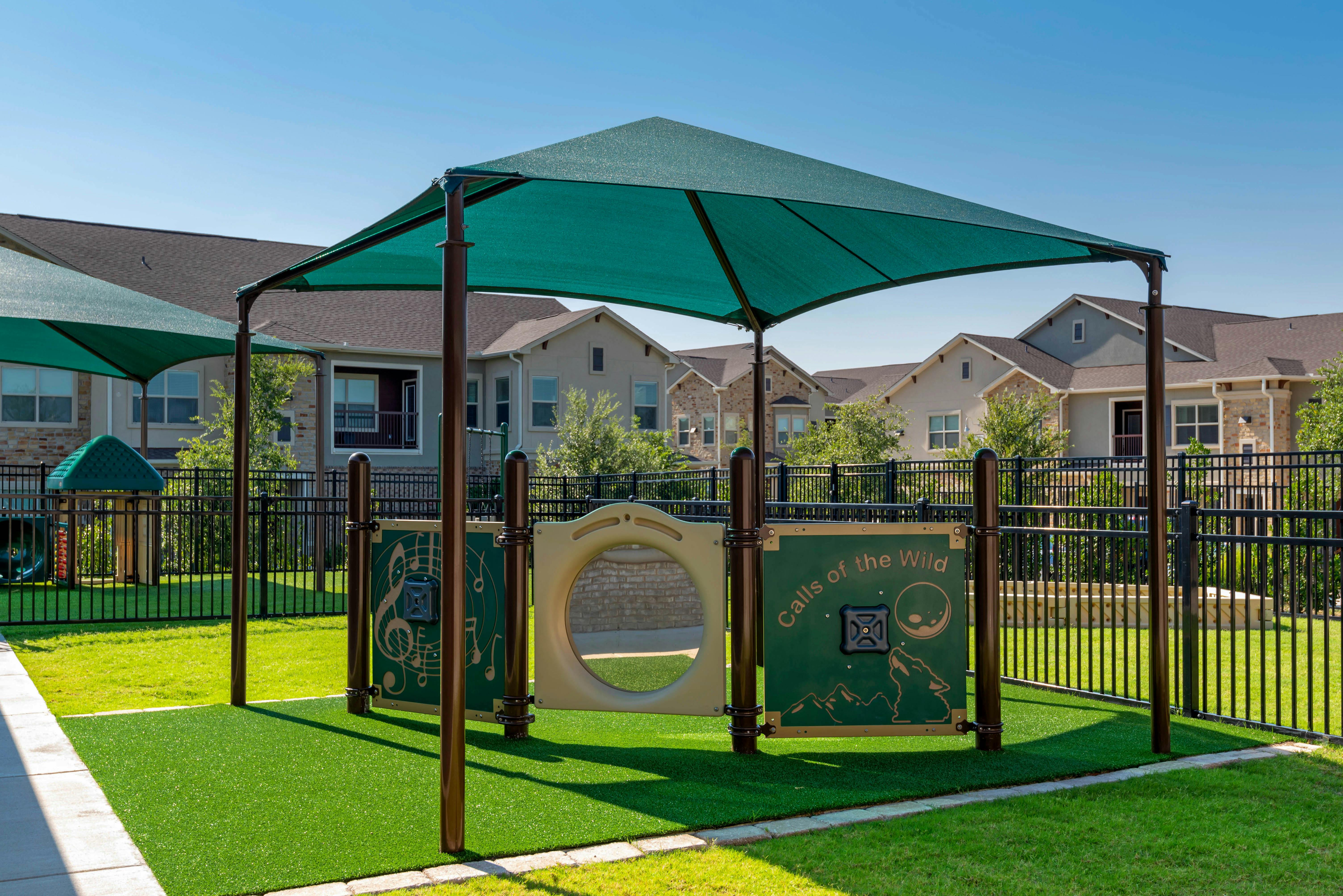 Covered playground structure with "Calls of the Wild" text