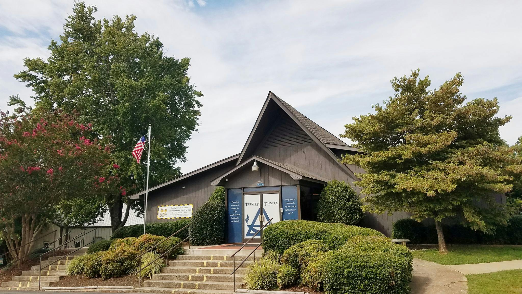 Building with a peaked roof and steps leading up to the entrance