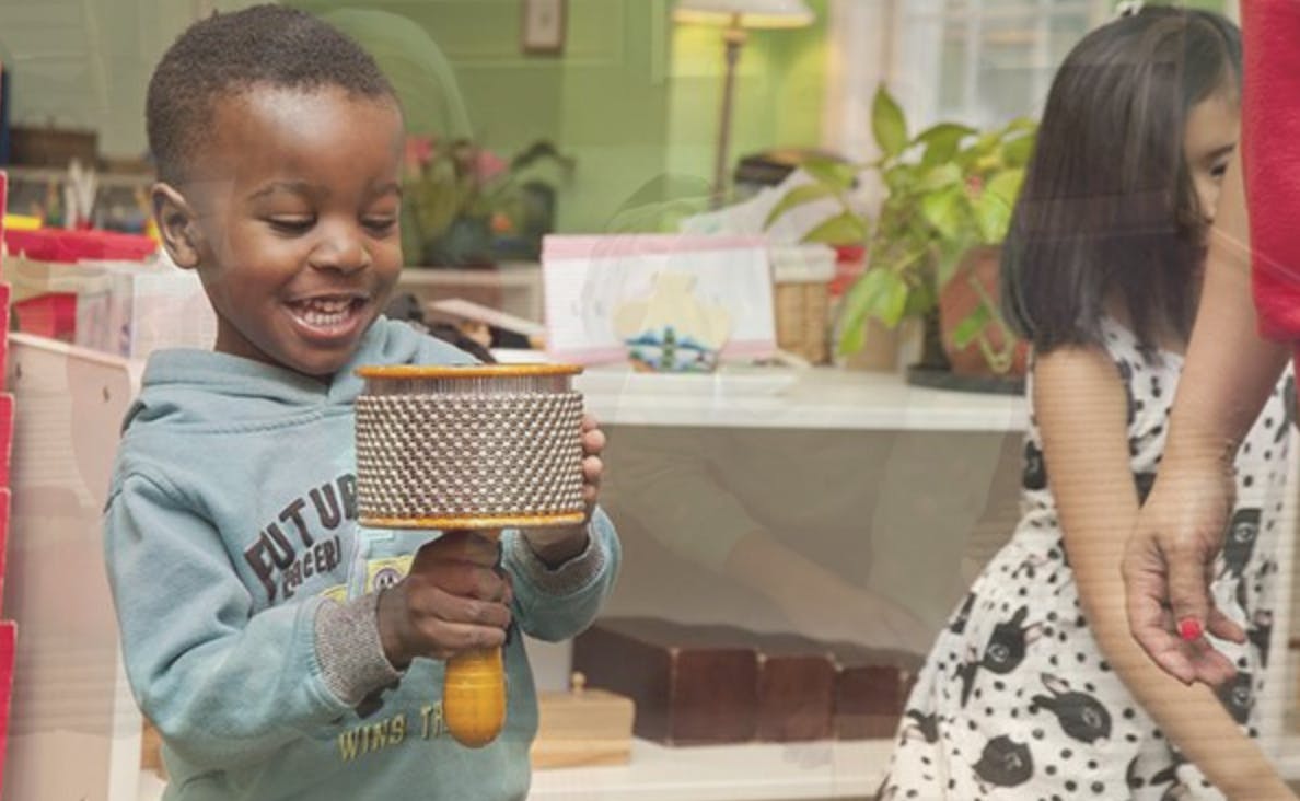 Child holding a maraca