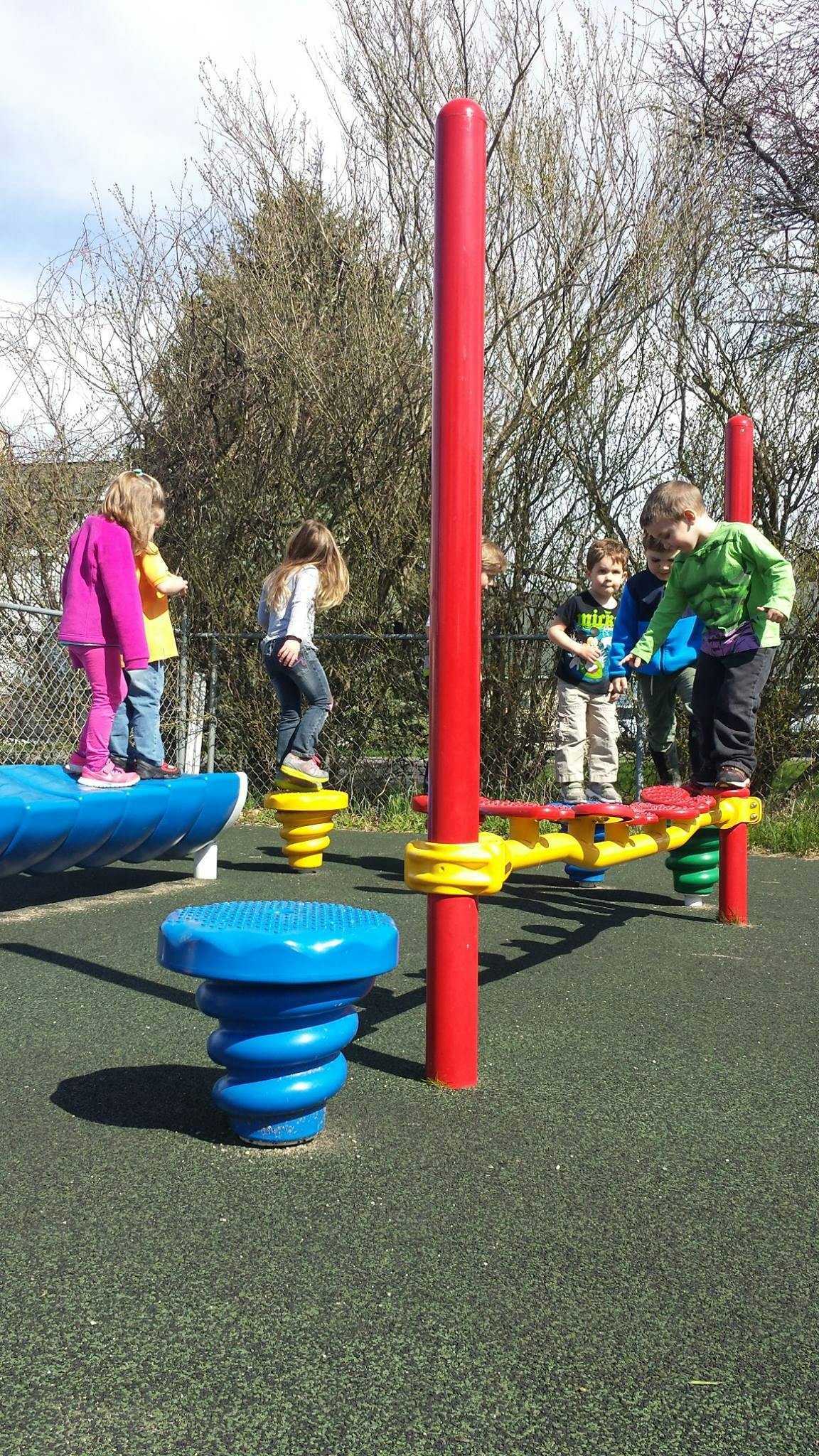 Children playing on playground equipment