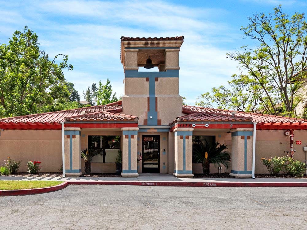 Building with a bell tower and red tile roof