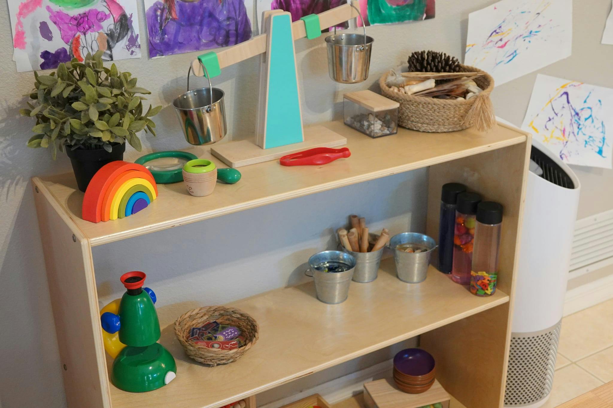 Shelves with various art supplies and toys in a classroom