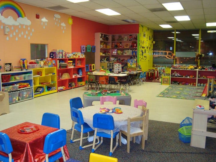 Colorful classroom with small tables and chairs