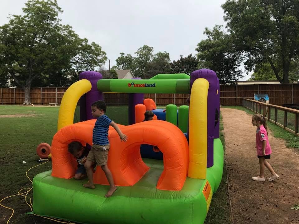 Children playing on an inflatable bounce house