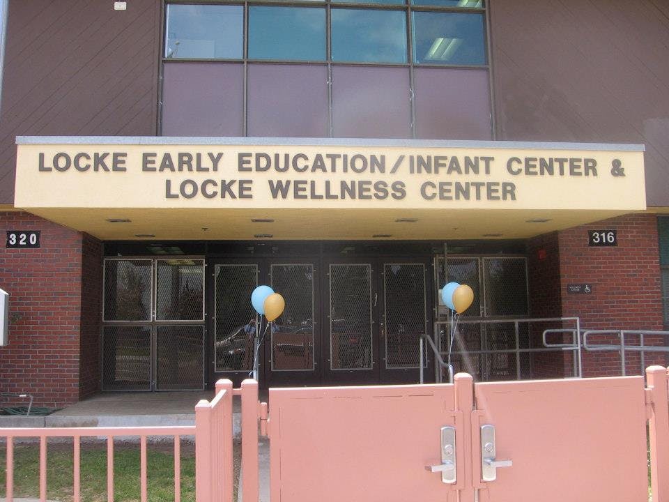 Locke Early Education/Infant Center & Locke Wellness Center sign above entrance
